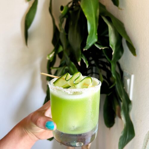 Refreshing Cucumber Cooler with blanco tequila, cucumber juice, and lime, served in a salted rim glass with ice for a light, low-sugar summer cocktail